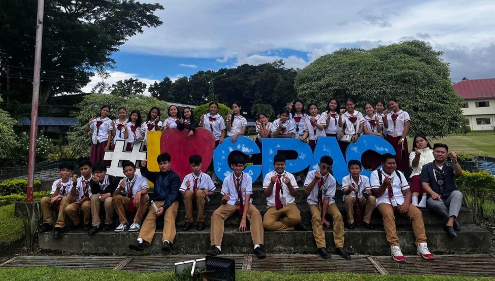 LJNHS Grade 8 STE students and teachers pose at the I love CPAC campus landmark